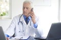 Male doctor making call Royalty Free Stock Photo