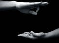 Shot of a male hand demonstrating Jnana Mudra or Wisdom mudra isolated on black background Royalty Free Stock Photo