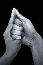 Shot of male hands doing Shankh mudra isolated on black background. Royalty Free Stock Photo