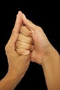 Shot of male hands doing Shankh mudra isolated on black background. Royalty Free Stock Photo