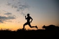 Shot of a male running and training with the dog Royalty Free Stock Photo