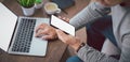 Shot of man hand using, holding smartphone or mobile mockup with blank white screen display. Royalty Free Stock Photo