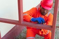 Shot of a man taking measurement outside the home