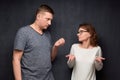 Shot of man trying to explain something to puzzled woman Royalty Free Stock Photo