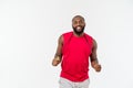 Shot of masculine man skipping rope. Muscular young man exercising with jumping rope against grey background