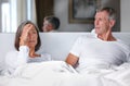 Im tired of arguing with you. Shot of a mature married couple having an argument in the bedroom. Royalty Free Stock Photo