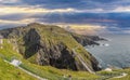 Shot of Mizen Head Bridge in Ireland against dramatic sky with sun rays daytime Royalty Free Stock Photo