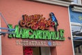 A shot of the neon sign outside of Jimmy Buffettâs Margaritaville restaurant and bar along Broadway street on a cloudy day