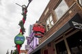 A shot of the neon sign outside of The Second Fiddle along Broadway street on a cloudy day in Nashville Tennessee Royalty Free Stock Photo