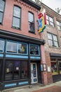 A shot of the neon sign outside of the Tin Roof bar along Broadway street on a cloudy day in Nashville Tennessee