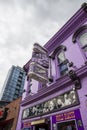 A shot of the neon sign outside of Tootsies Orchid Lounge along Broadway street on a cloudy day in Nashville Tennessee