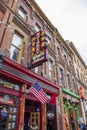 A shot of the neon sign outside of the Whiskey Bent Saloon along Broadway street on a cloudy day in Nashville Tennessee Royalty Free Stock Photo