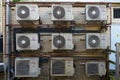 Shot of nine air conditioning condenser units on the side of a building Royalty Free Stock Photo