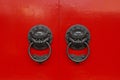 Shot of an old Chinese styled metallic doorknobs with lion guardians