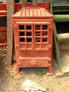 shot of an old rusty rural cast iron heating stove that burnt wood or coal. Fireplace. Copyspace