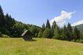 Old wooden house in mountains. Alone cabin in the mountain fores