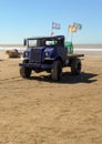 Old blue rusty 1940s Ford Blitz truck still in use to tow fishing boats on the beach. Copyspace