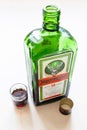 Shot and open bottle of Jagermeister digestif Royalty Free Stock Photo