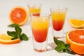 Shot with orange taste, tasty citrus shot concept