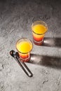 Shot with orange taste, tasty citrus shot concept