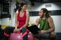 Personal trainer having a training consultation with a client Royalty Free Stock Photo