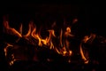 Shot of a piece of woods burning in the fire flames in the night Royalty Free Stock Photo
