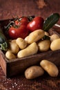 Small new potatoes on rustic box Royalty Free Stock Photo