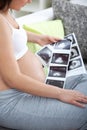 A shot of a pregnant woman looking her child's ultrasound pictu Royalty Free Stock Photo