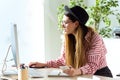 Pretty young business woman working with her laptop in the office. Royalty Free Stock Photo