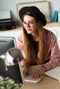 Pretty young business woman working with her laptop in the office. Royalty Free Stock Photo