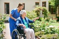 Id like to go that way. Shot of a resident and a nurse outside in the retirement home garden. Royalty Free Stock Photo