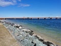 Shot of the rocky seashore on the Bribie Island Bridge background Royalty Free Stock Photo