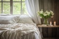 shot of a scandinavian bedroom with white linens and a soft lamp