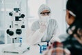 When in doubt consult the expert. Shot of a scientist in hazmat having a consultation with a patient in a laboratory.