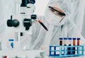 The answers are in the details. Shot of a scientist in hazmat suit conducting medical research in a laboratory.