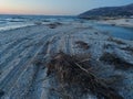 shot of scrap poles on a pebble beach by the Ionian Sea in Orikhum