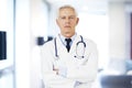 Serious face male doctor portrait while standing in the hospital Royalty Free Stock Photo