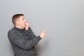 Shot of shocked frightened man pointing with finger at something awful Royalty Free Stock Photo