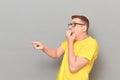 Shot of shocked frightened man pointing with finger at something awful Royalty Free Stock Photo