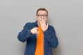Shot of shocked frightened man pointing with finger at something awful Royalty Free Stock Photo