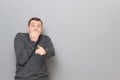 Shot of shocked frightened man pointing with finger at something awful Royalty Free Stock Photo