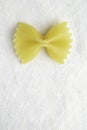 Shot of a single bow tie pasta isolated in a white background Royalty Free Stock Photo