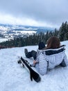 Shot of a skier woman sitting on the ski slope resting relaxing extreme recreation active lifestyle activity. Female Royalty Free Stock Photo