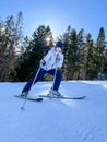 Shot of a skier woman sitting on the ski slope resting relaxing extreme recreation active lifestyle activity. Female Royalty Free Stock Photo