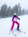 Shot of a skier woman on the ski slope resting relaxing extreme recreation active lifestyle activity. Female skier on a Royalty Free Stock Photo