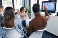 Smart young business people working and talking of they new project while doing a video call with company director in coworking Royalty Free Stock Photo