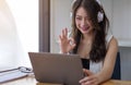 Shot of smiling businesswoman looking at camera webcam make conference business group call, online training concept Royalty Free Stock Photo