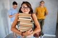 A shot of a smiling college student reading a book Royalty Free Stock Photo