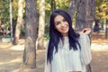 A shot of a smiling confident Asian Indian woman outdoor