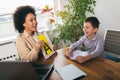 Speech therapist during a session with a little boy